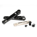 Description: The Eclat Tibia XLT Cranks feature a black BMX crankset with a silver spindle and various small parts, including bolts and screws, all meticulously arranged on a white background.