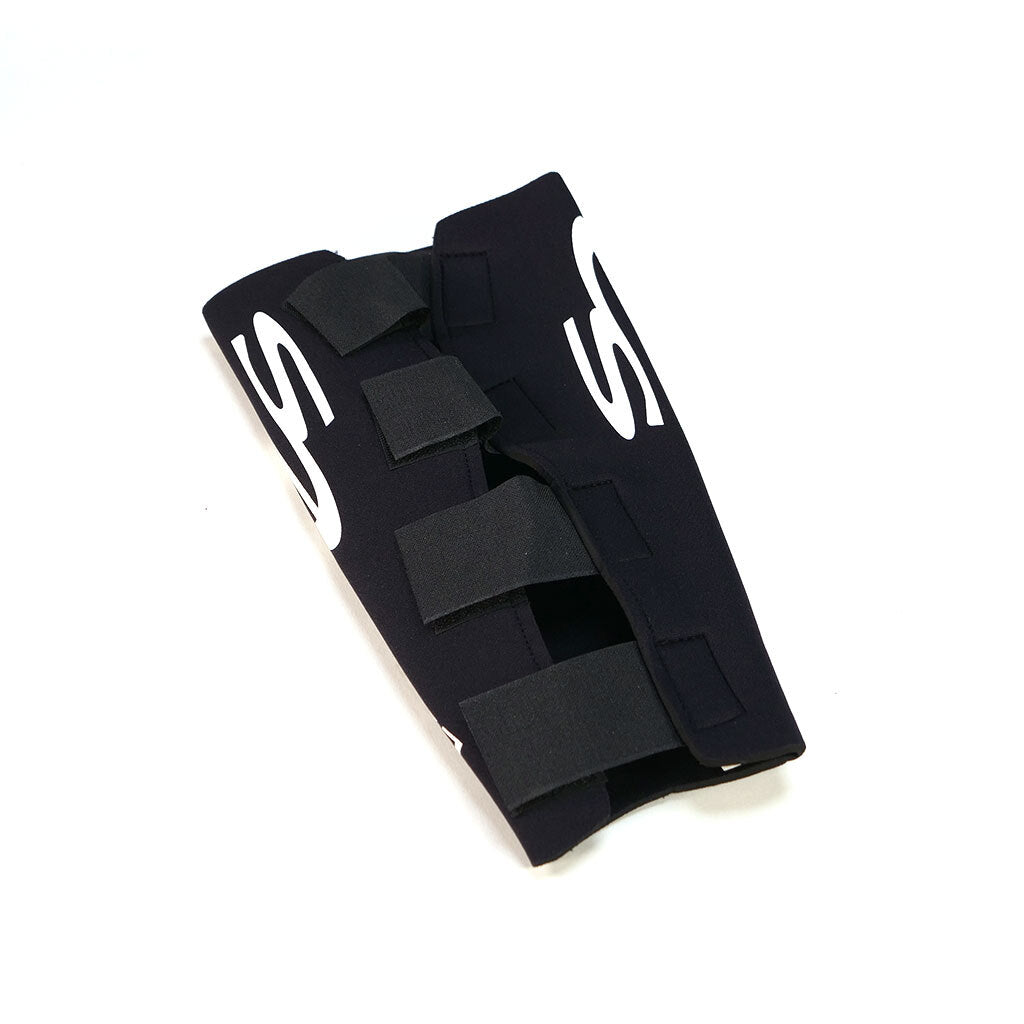 A pair of Elephant Skins Shin Pads, black neoprene with white lettering and Velcro straps, offers lightweight protection and is displayed on a white background.