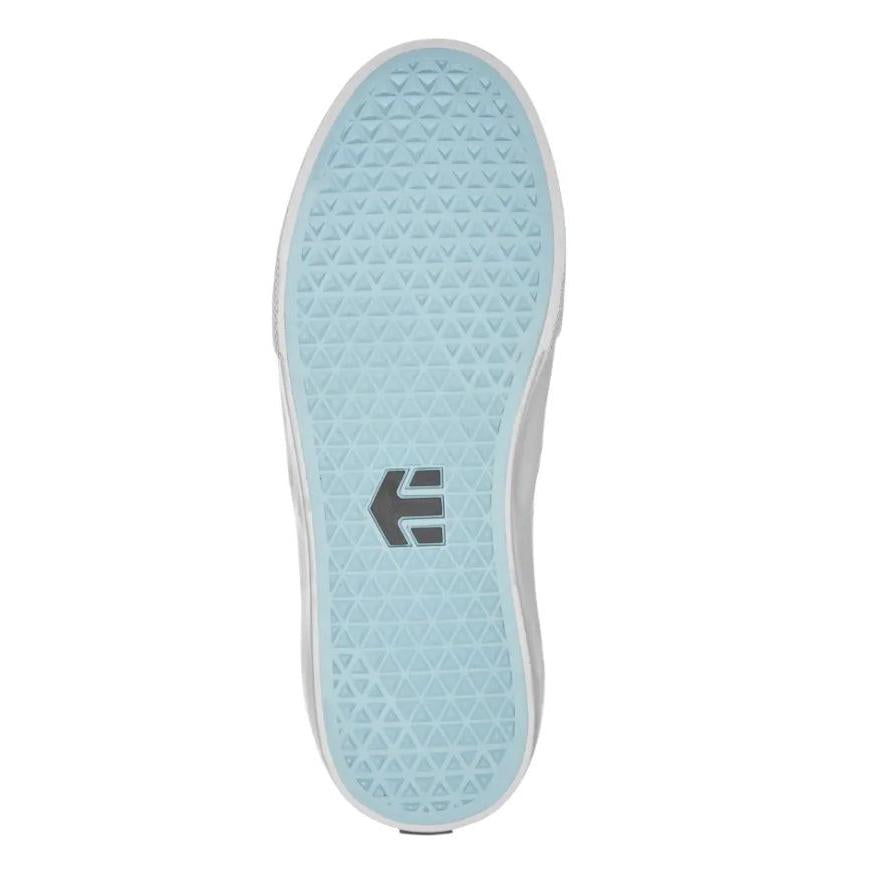 Bottom view of the Etnies Lo-Cut X DIG Slip-on in Black/Blue, showcasing a light blue rubber sole with a triangular tread pattern that's ideal for shredding, complete with a logo positioned in the center.