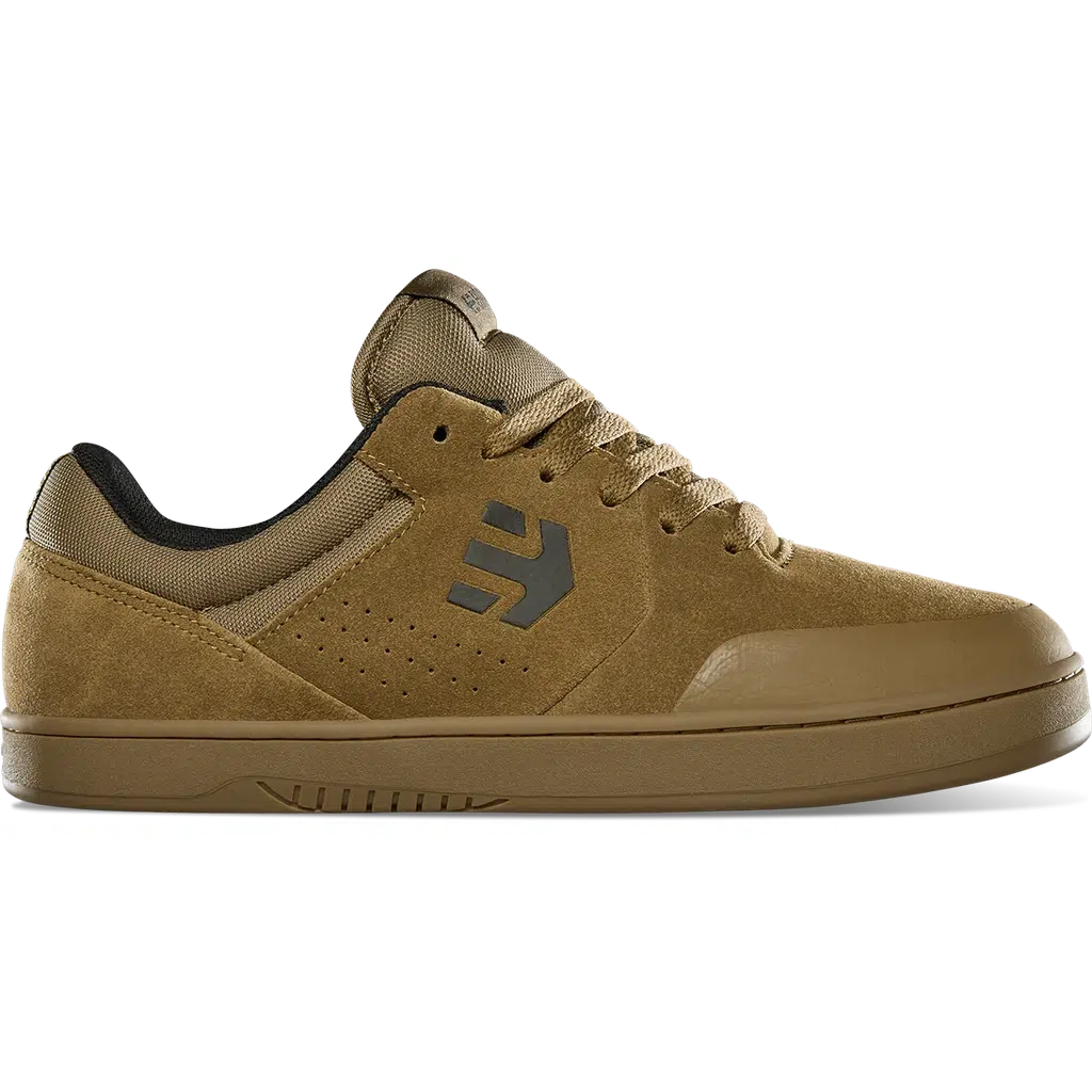 Introducing the Etnies Marana Michelin Shoe in Brown/Black/Gum, sporting a gray logo on the side. This skate shoe offers a lace-up design and a textured sole made from Michelin performance rubber, making it an ideal choice for skateboarders.