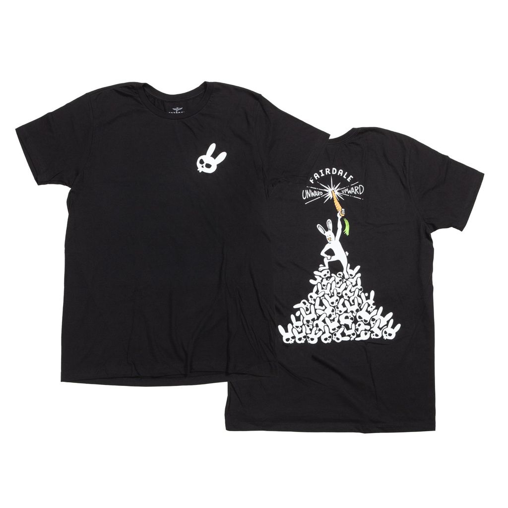 Introducing the Fairdale Vanquish T-Shirt: a black tee featuring a small white skull on the front and an imaginative back design with a rabbit perched atop a pile and a carrot dangling from an umbrella.