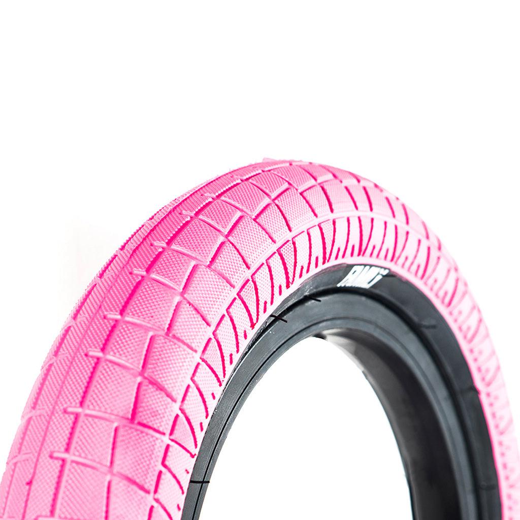 A pink Family BMX F2128 12 Inch Tyre on a white background, perfect for riding.