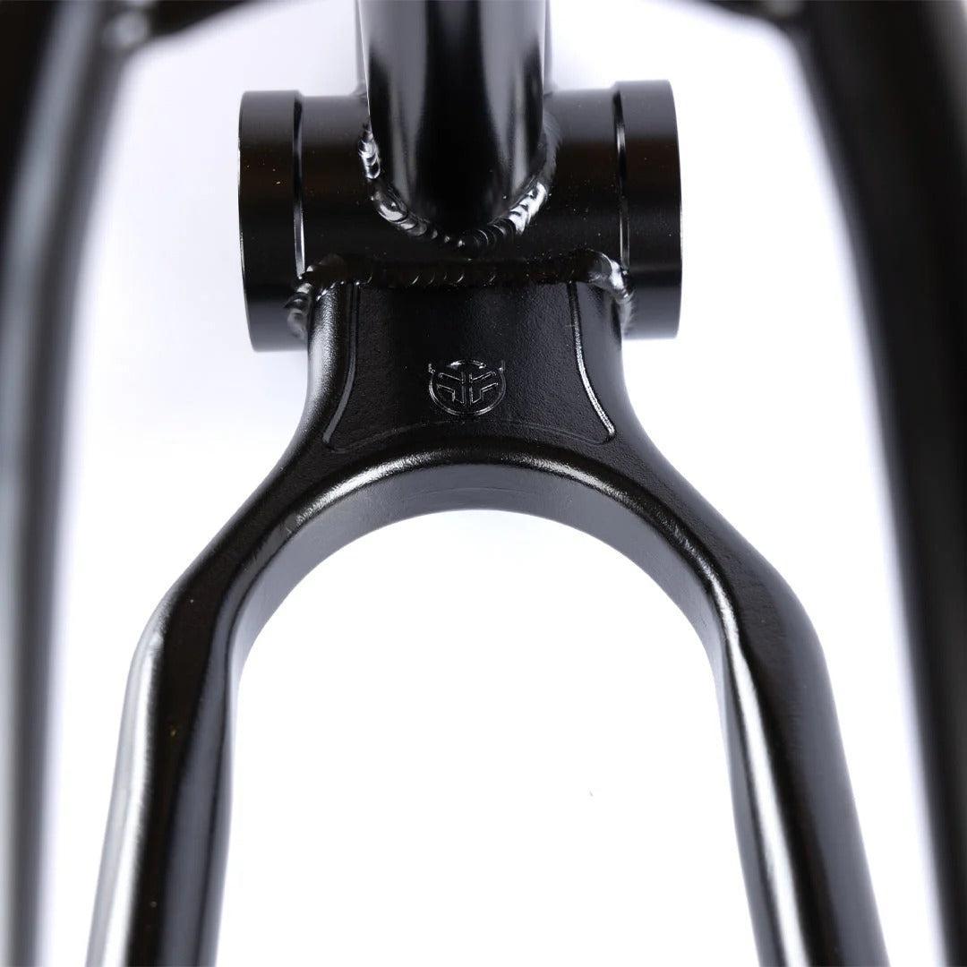 Close-up of the Federal Team ICS2 Frame in black, featuring smooth welds and a small embossed logo on 4130 Chromoly tubing—designed for technical street riding.