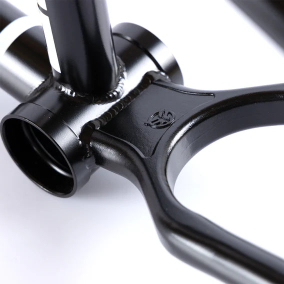 Close-up of the Federal Bruno ICS2 Frame, a black 4130 Chromoly BMX frame, highlighting the bottom bracket area and welds, with the manufacturer's logo stamped on the surface.