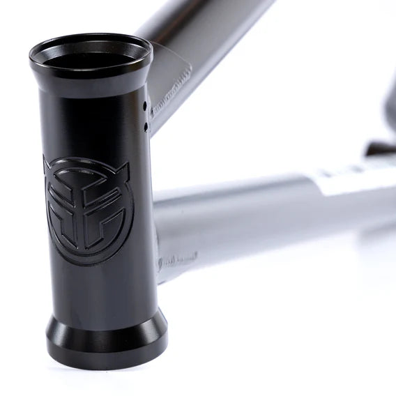 Close-up of the Federal Bruno ICS2 Frame in matte black, featuring an engraved logo on the head tube and constructed from strong 4130 Chromoly tubing.