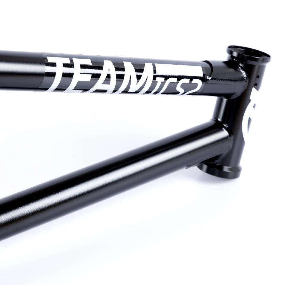 Close-up of the black Federal Team ICS2 Frame, crafted from durable 4130 Chromoly with “TEAM ICS2” in white on the top tube—ideal for technical street riding against a clean white background.