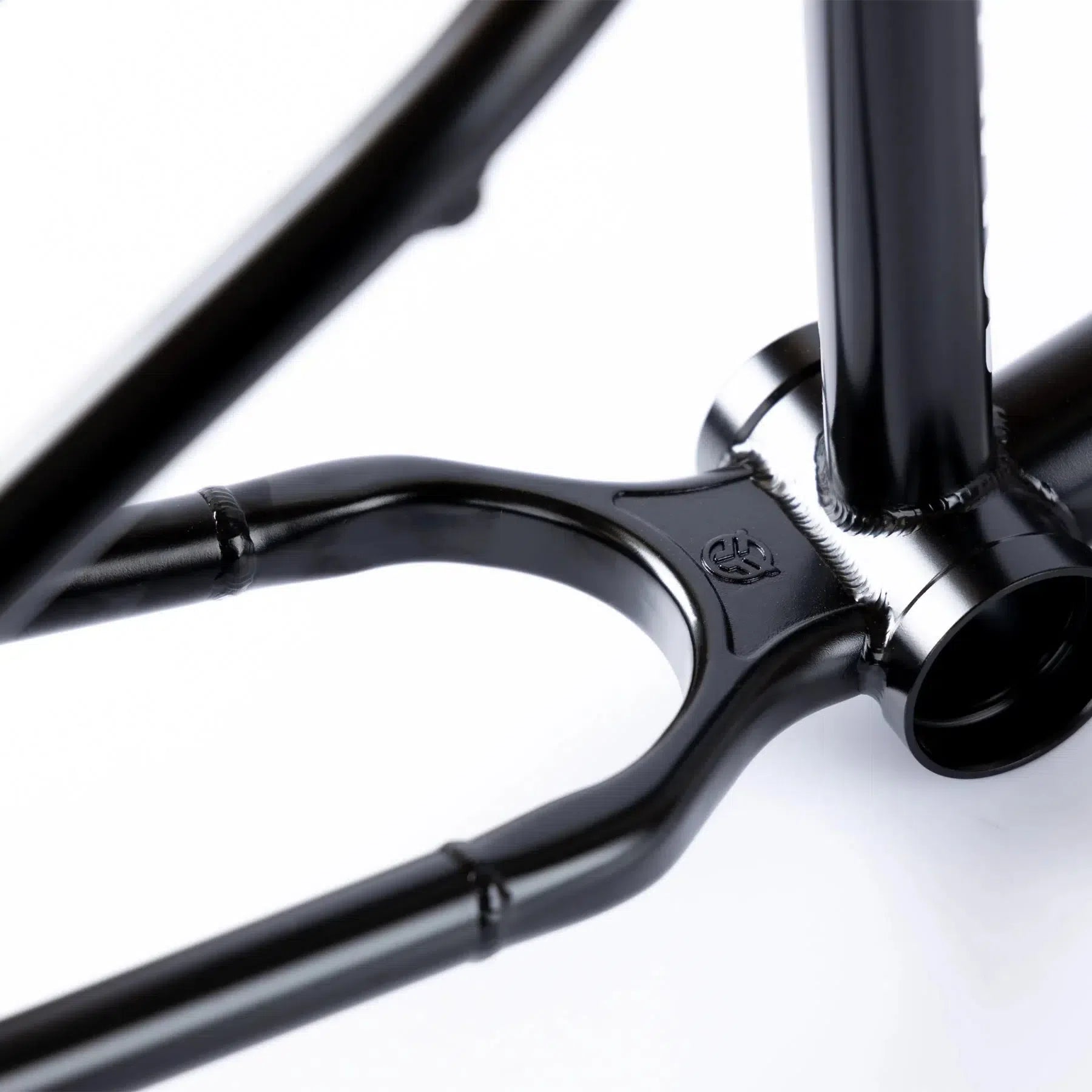 Close-up of a Federal Command ICS2 Frame crafted from 4130 Chromoly, showcasing the bottom bracket and chainstay area with smooth welds and a glossy finish.