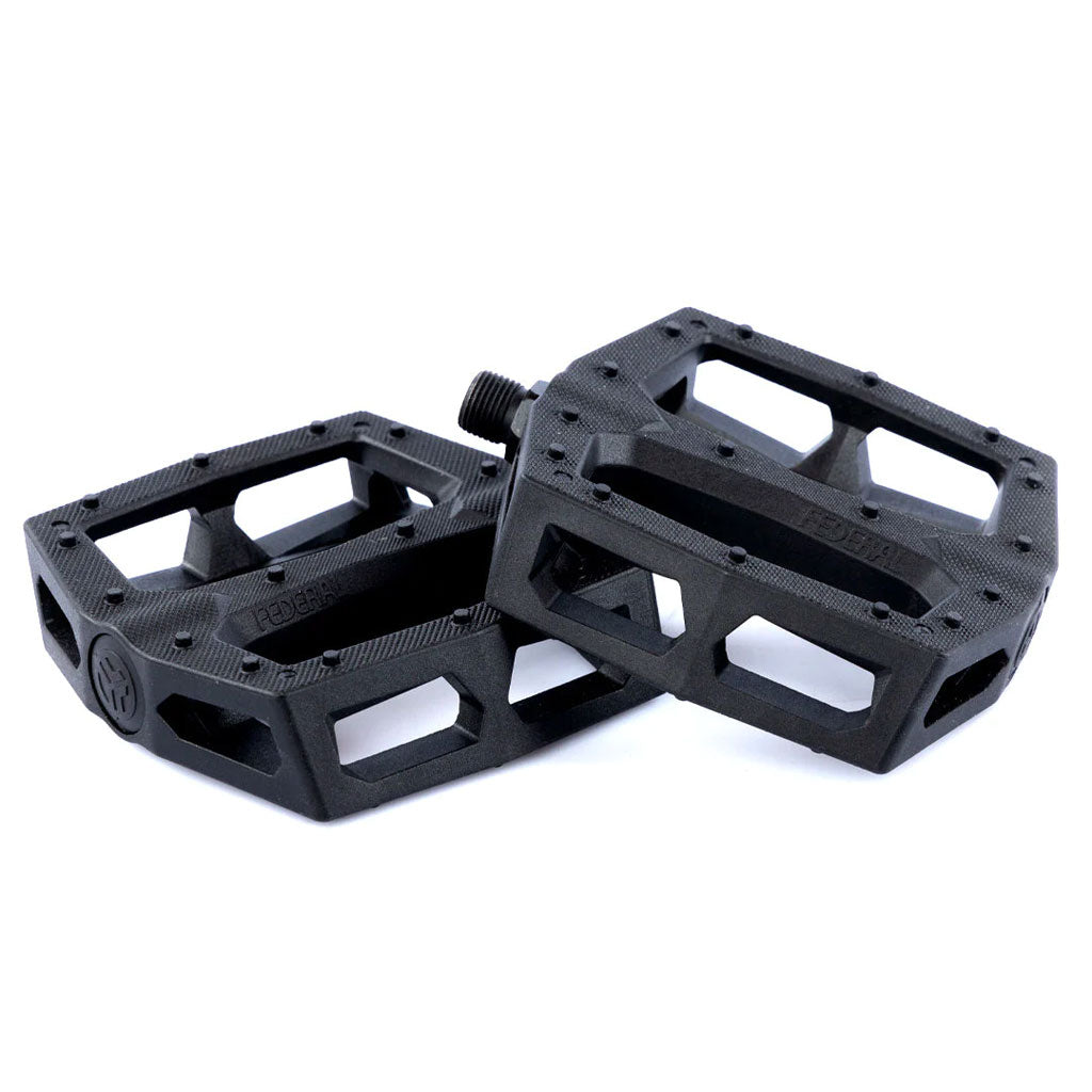 Federal Command XL Plastic Pedals in black with an open cut-out design and textured surface for grip, ideal for crank arm grinds, are shown on a white background.