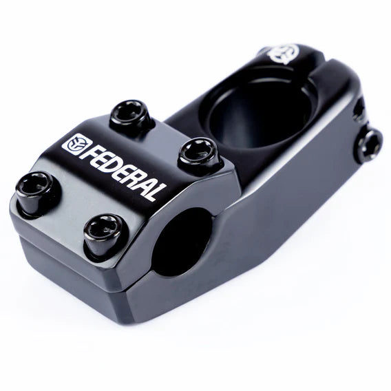 The Federal Element V2 Top Load Stem is a stylish BMX component, crafted from cold-forged 6061 Aluminium in a black finish. It features the logo prominently on the front and includes bolt attachments for secure handling.