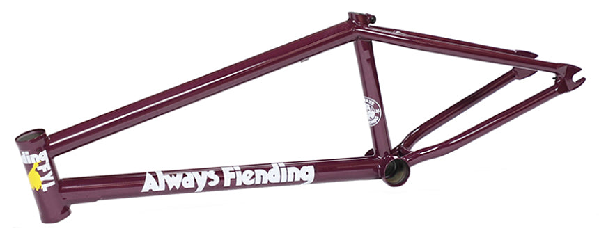 A maroon Fiend Reynolds V4 Frame (Garrett Reynolds Signature) made from heat treated 4130 chromoly, featuring white “Always Fiending” text and yellow and white details on the head tube, shown from a side view.