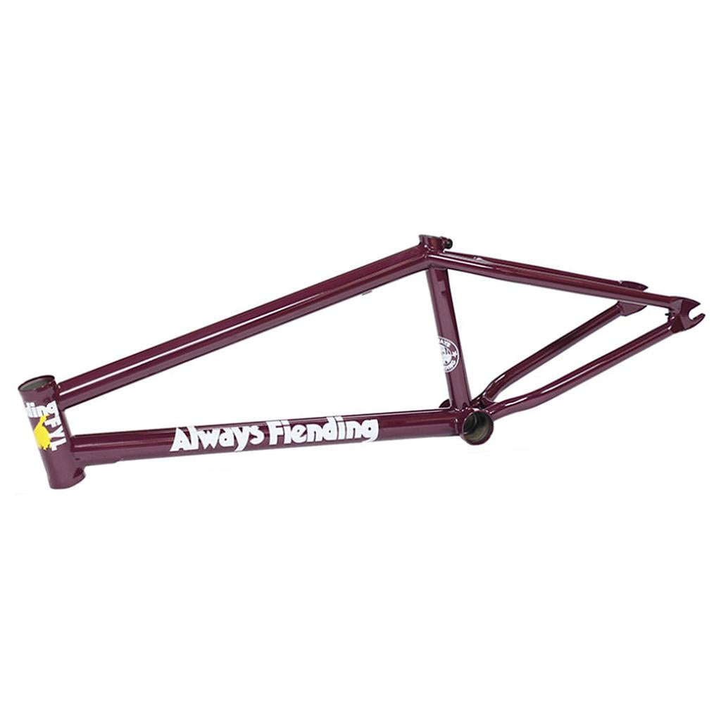 A maroon Fiend Reynolds V4 Frame (Garrett Reynolds Signature) made from heat treated 4130 chromoly, featuring white “Always Fiending” text and yellow and white details on the head tube, shown from a side view.