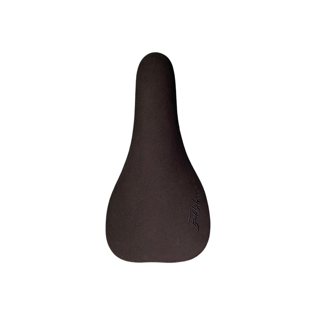 The Fit Bike Co Microfibre Railed Seat is black with a teardrop shape, featuring a textured microfiber cover and an embroidered logo for added style.