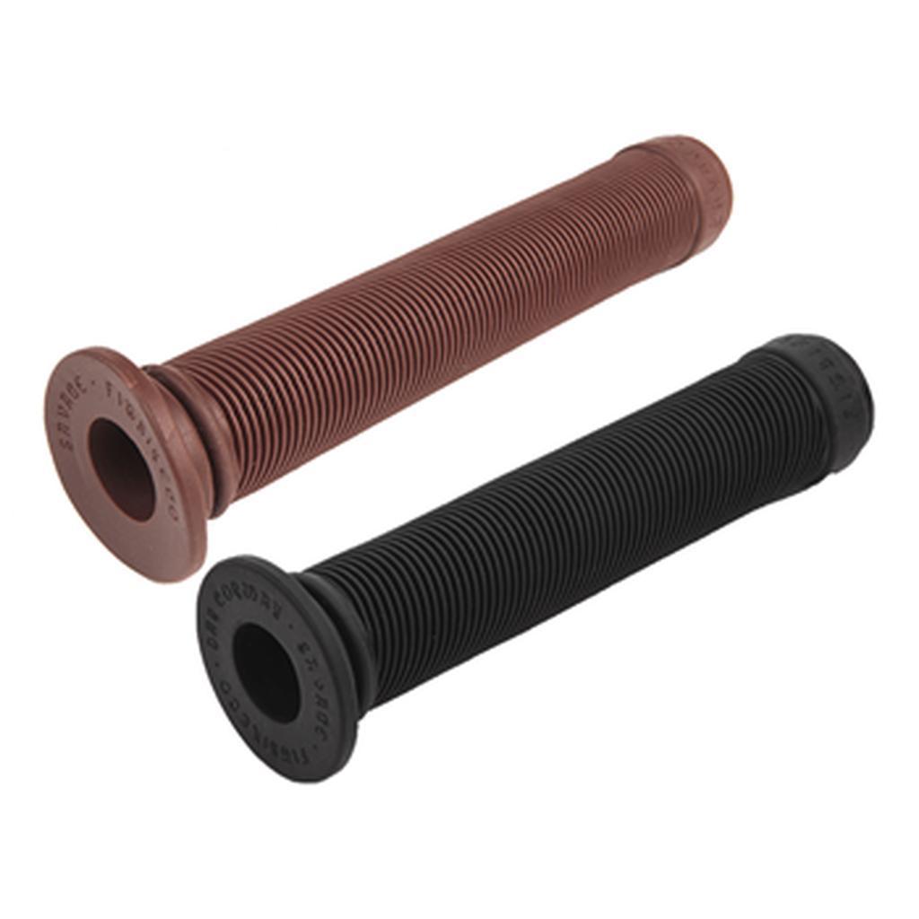 Two Fit Savage V2 Grips, one brown and one black, with ribbed cylindrical design, mid flange, and made from extra soft rubber are shown side by side on a white background.