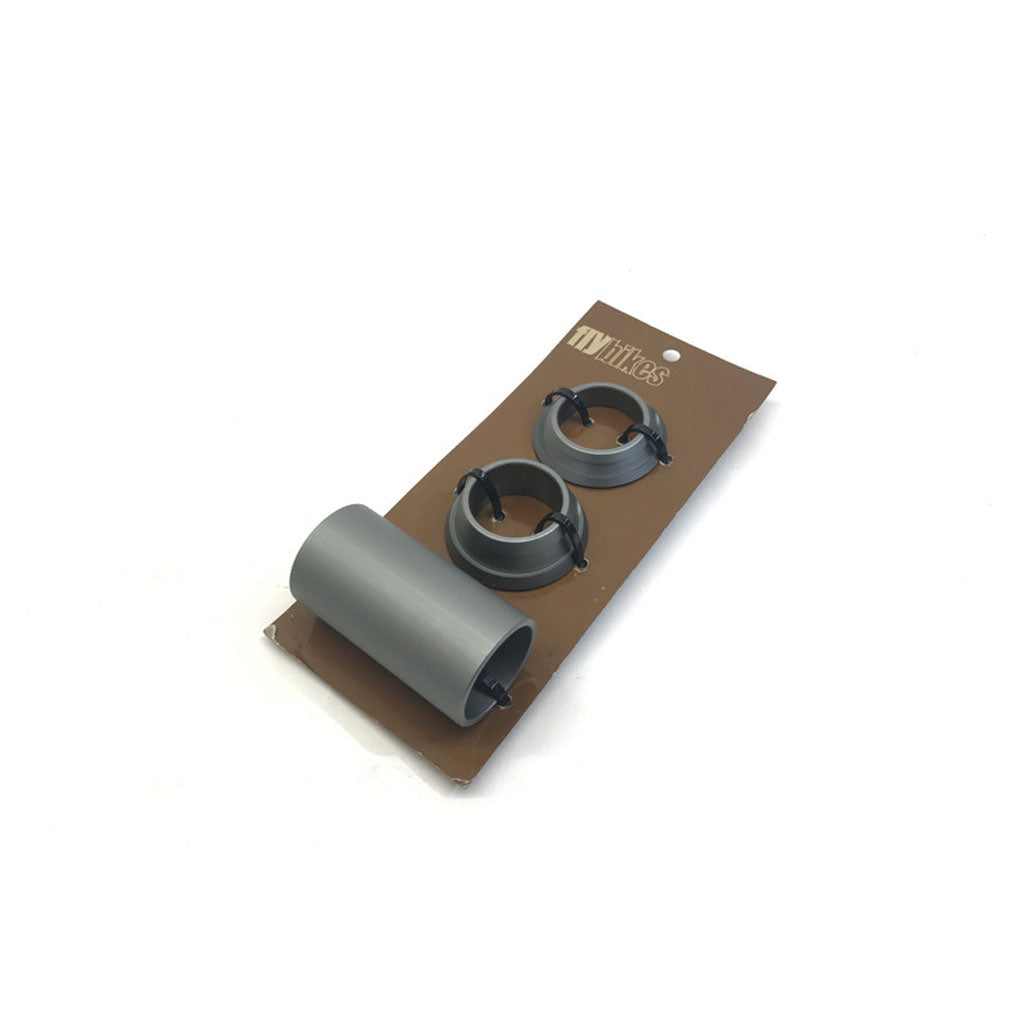 Gray 22mm plastic rings and a cylinder, identifiable as Fly 22mm Spanish BB Spacers Only, are displayed on a brown cardboard backing against a white background.
