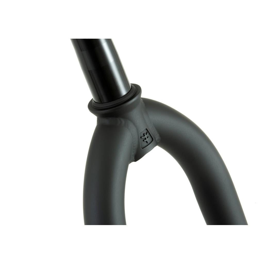Close-up of a black Fly Bikes 18 Inch Volcano Fork featuring the steerer tube and fork crown, with an embossed logo. Rest assured with a lifetime warranty on this essential component of the Fly Bikes 18” complete bike.