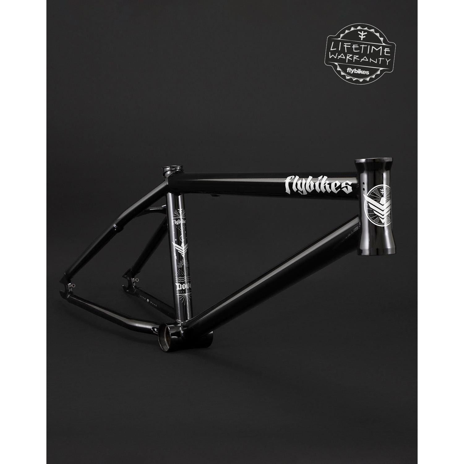 The Fly Bikes Dove 13.6 Frame (Josh Dove Signature) in black showcases silver decals on a dark base, optimized for seamless transition riding. "Lifetime Warranty" and "flybikes" branding emphasize its robust geometry.
