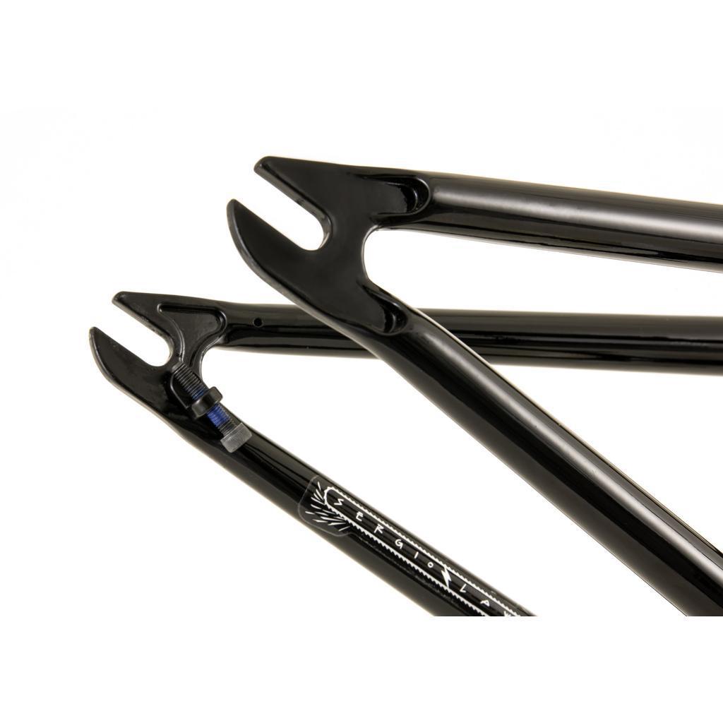 Close-up of the Fly Bikes Motosierra Frame's black fork dropouts and frame with logo, showcasing welded chainstay brake mounts that enhance its trail-specific geometry.