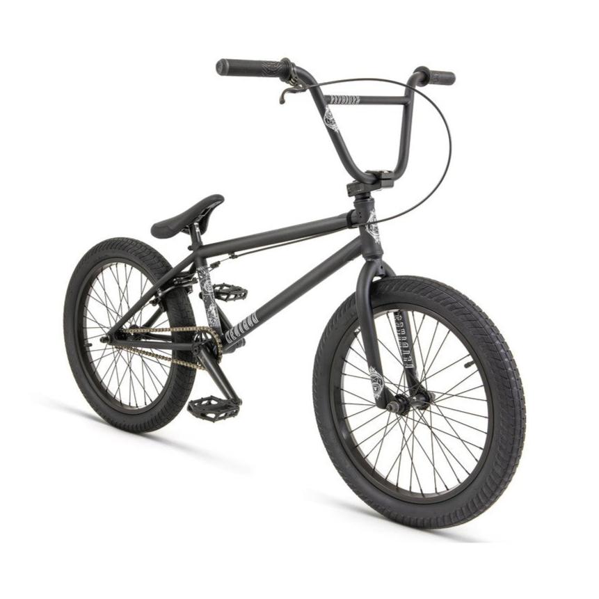 The Fly Bikes Neutron 20 Inch Bike, a Ruben Alcantara signature model, boasts a sleek black design with thick tires and a sturdy CrMo frame. Its compact structure and front brake cable stand out beautifully against the white background.