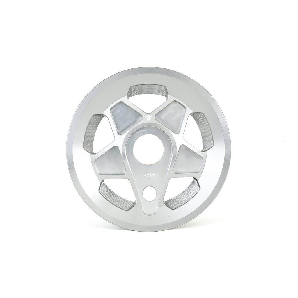 The Fly Bikes Tractor Guard Sprocket is a sleek silver wheel rim, crafted from 6061 Aluminum, featuring a circular design with five distinct cutouts and a central hub.