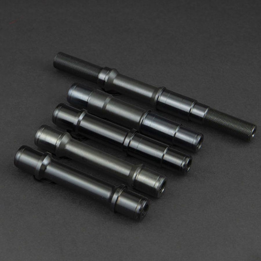 Four replacement Fly Bikes Magneto Female Front Axles on a black surface.