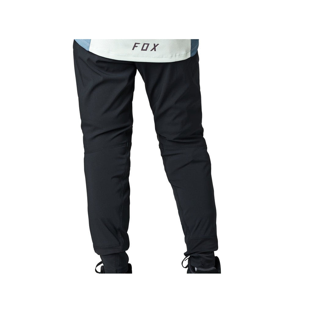 The back view of a man wearing Fox Womens Defend Pants.