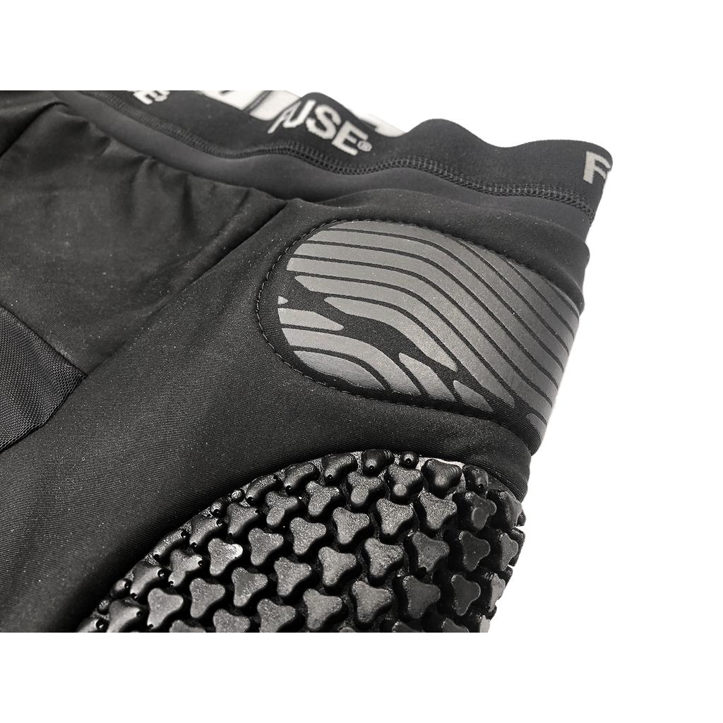 Close-up of black Fuse Impact Shorts showcases textured padding on the hip and thigh for added protection, enhanced with SAS-TEC inserts for superior defense.