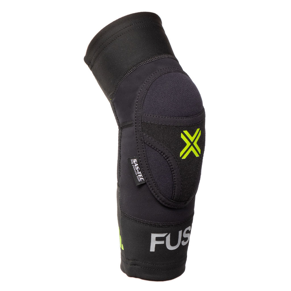 A black Fuse Omega Elbow Pads with a green "X" design and the brand name "FUSE" on it. It features a lightweight breathable Lycra and includes a super light SAS-TEC insert for extra protection.