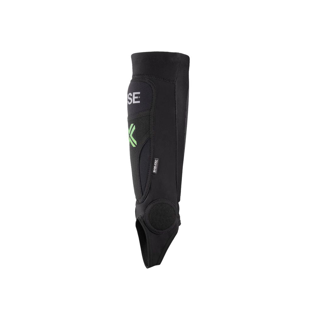 The Fuse Omega Pro Shin/Ankle Combo Pads pair showcases a black curved design with green accents, utilizing advanced FUSE Omega PRO technology. Additionally, they are equipped with Velcro straps for effortless adjustment.