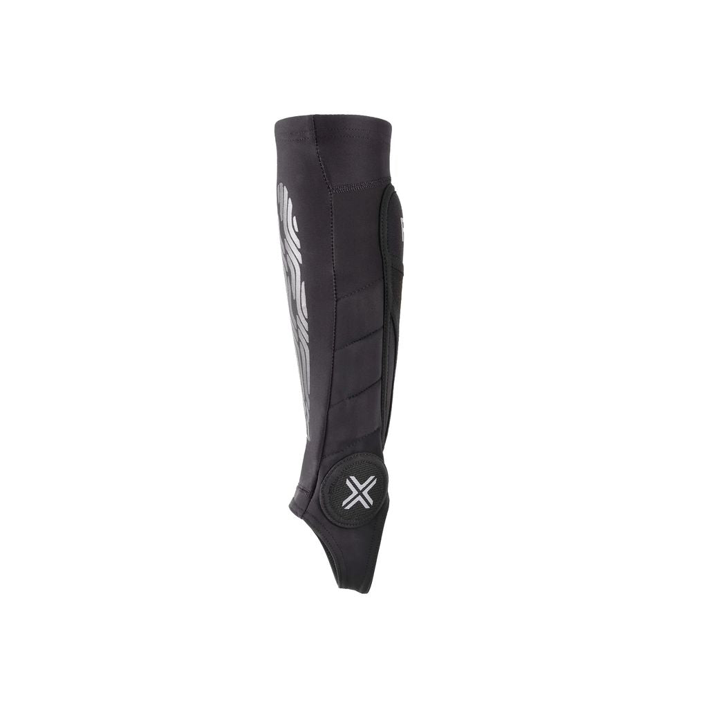 The Fuse Omega Pro Shin/Ankle Combo Pads (Pair) showcase a sleek black appearance with a white logo and abstract side design, featuring a strapless construction for maximum comfort.