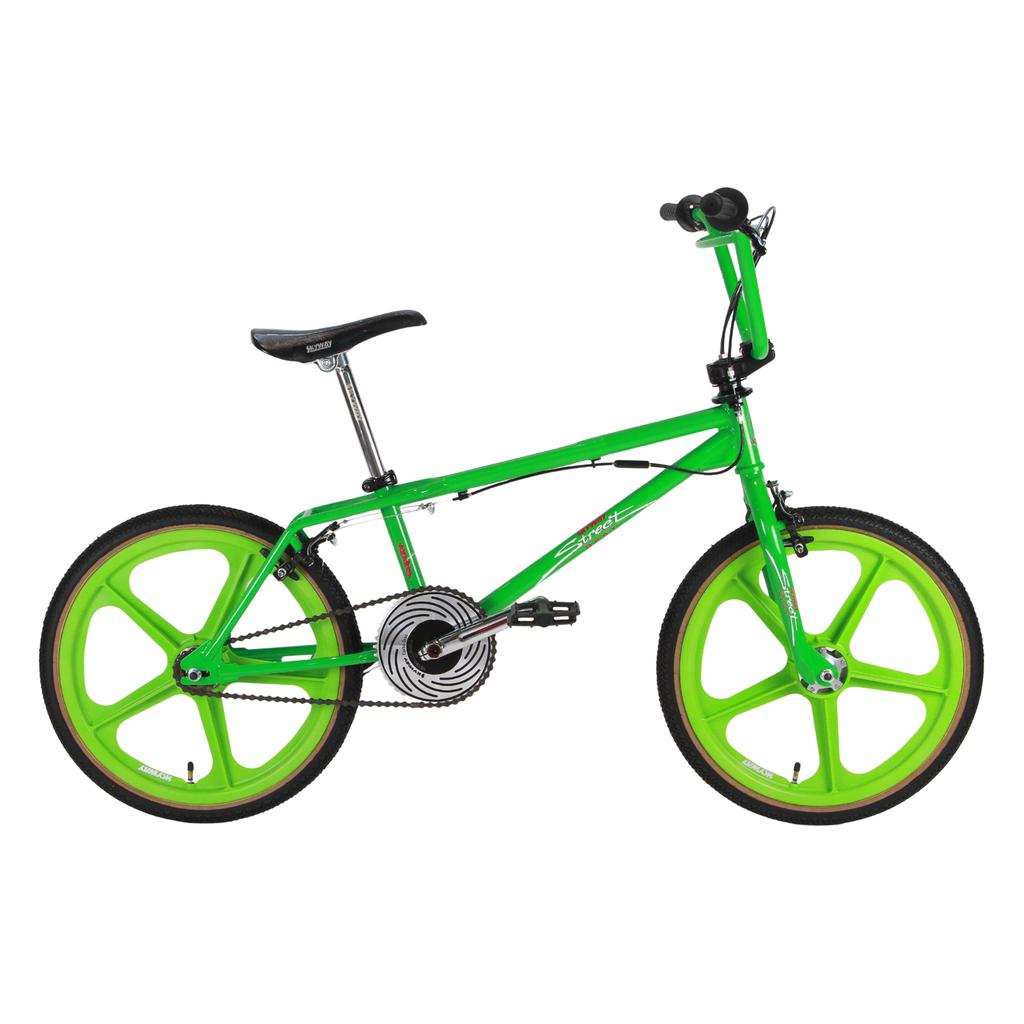 The Skyway Street Beat EX 20 Inch Bike features a bright green 4130 chromoly frame, mag wheels, black handlebars, seat and pedals, plus a silver chain and gear system—an homage to the iconic Street Beat BMX design.
