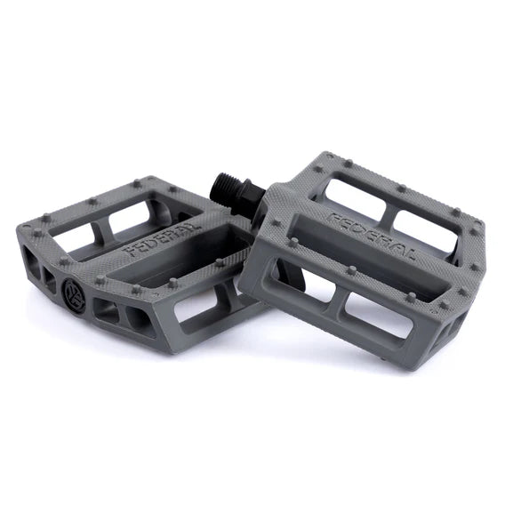 A pair of gray Federal Contact Pedals with chromoly spindles, designed with a rectangular shape and cut-out sections for better grip, is shown on a white background.