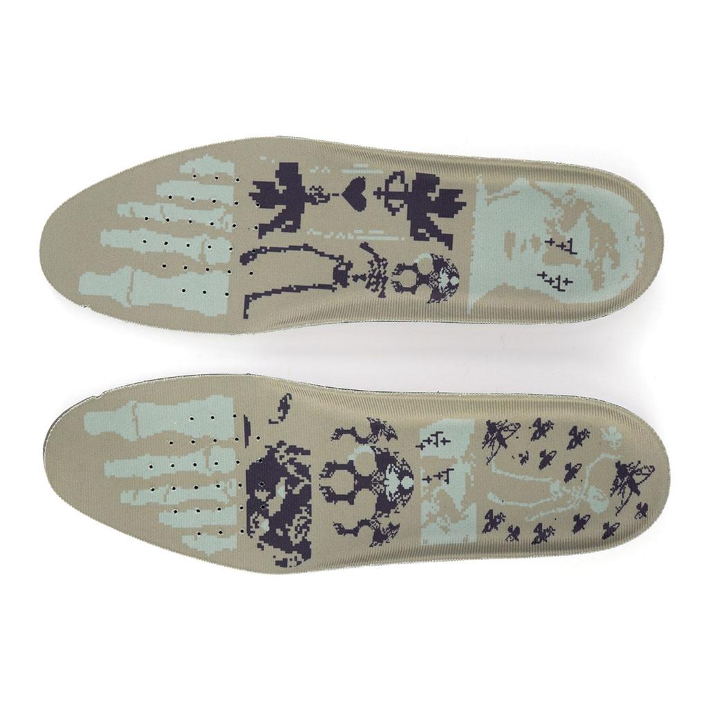 The Higher Crypt Suede Lace Up Shoes (Black/Black) include two insoles with light blue and black skulls, candles, keys, and symbols on beige. Finished with a suede upper and signature outsole grip for stylish comfort.