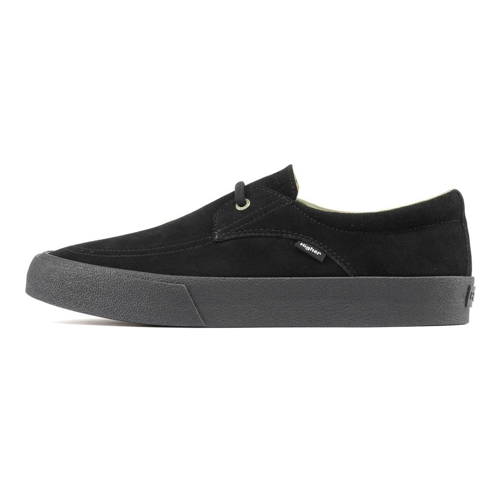 The Higher Salem Suede Slip On Shoes are black low-top BMX sneakers featuring a suede upper, thick black rubber sole, reinforced toe box, minimal stitching, and a small side tag with the brand name.