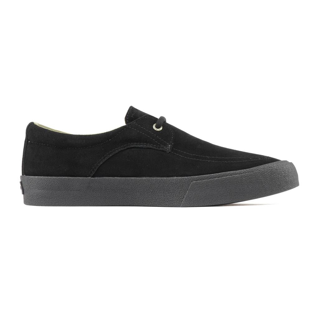 The Higher Salem Suede Slip On Shoes in black feature a reinforced toe box, minimal stitching, and a black rubber sole. Shown in side profile against a white background.