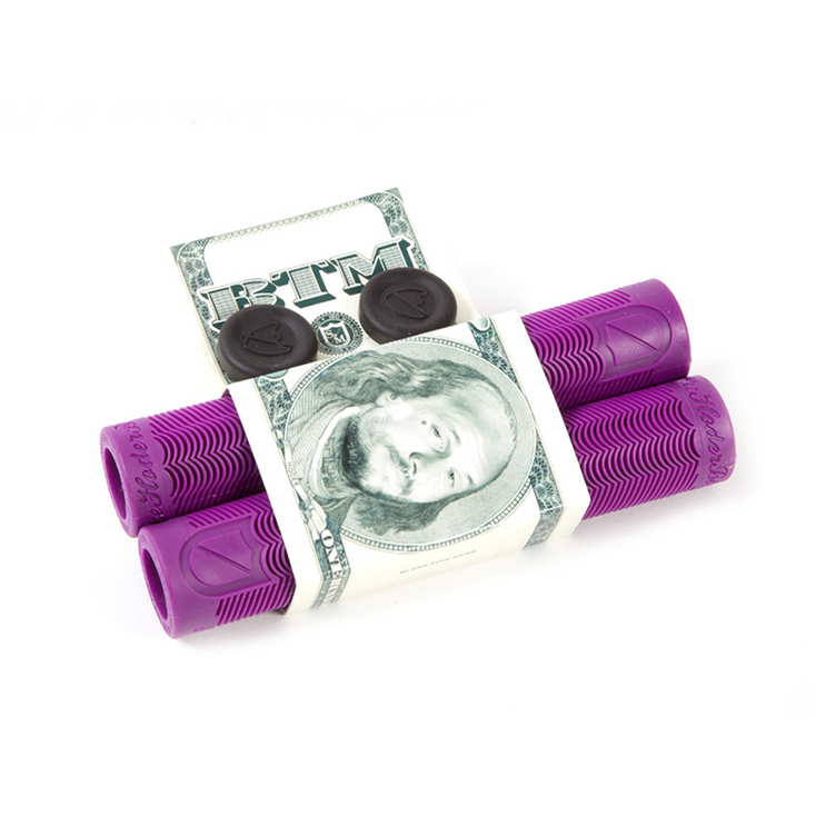 A hundred dollar bill folded and inserted into a pair of purple, capped silicone S&M Hoder Grips designed to hold small items, isolated on a white background.