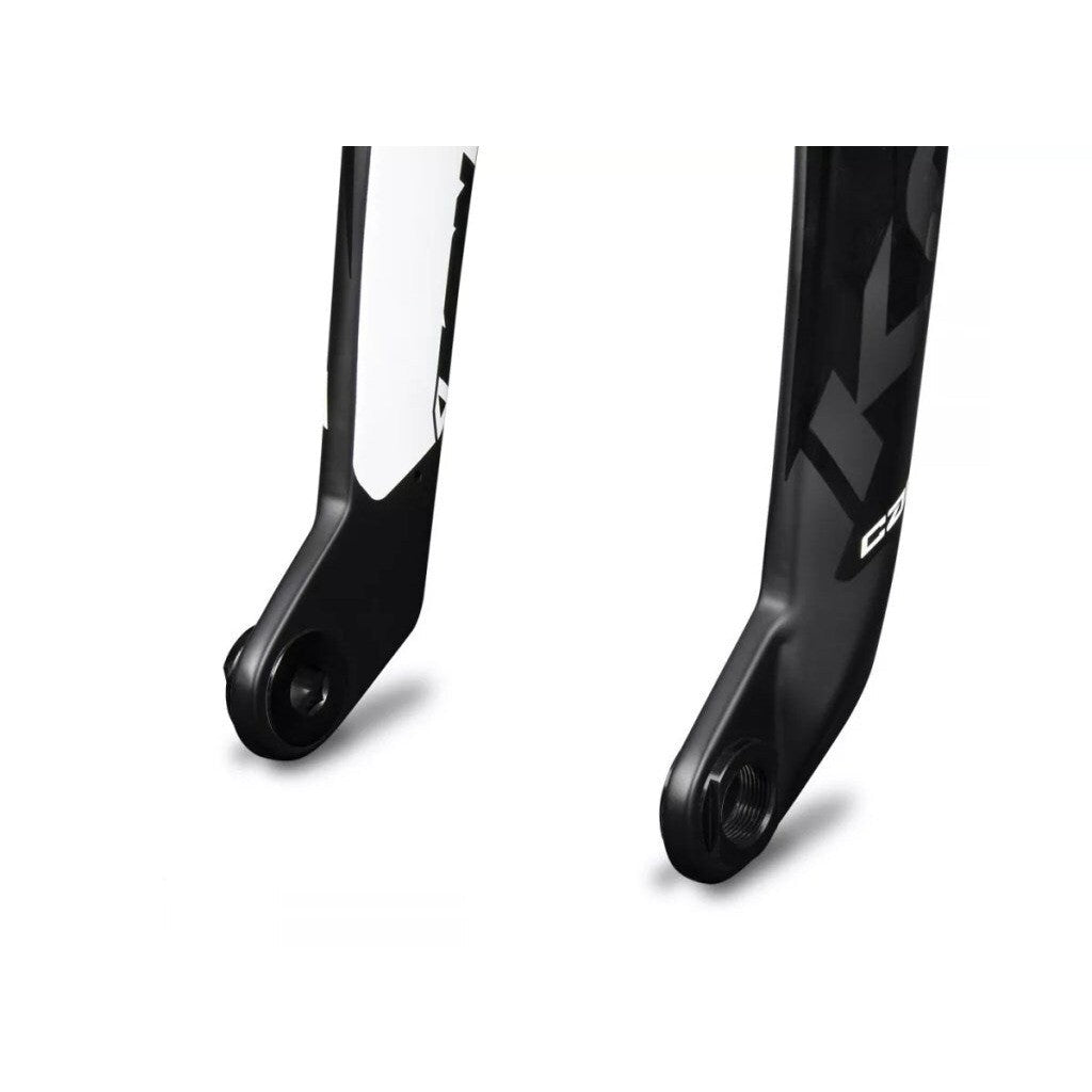 Two Ikon 20-10mm Fork Adapters bicycle forks side by side, one primarily white with black details and the other primarily black with white details.