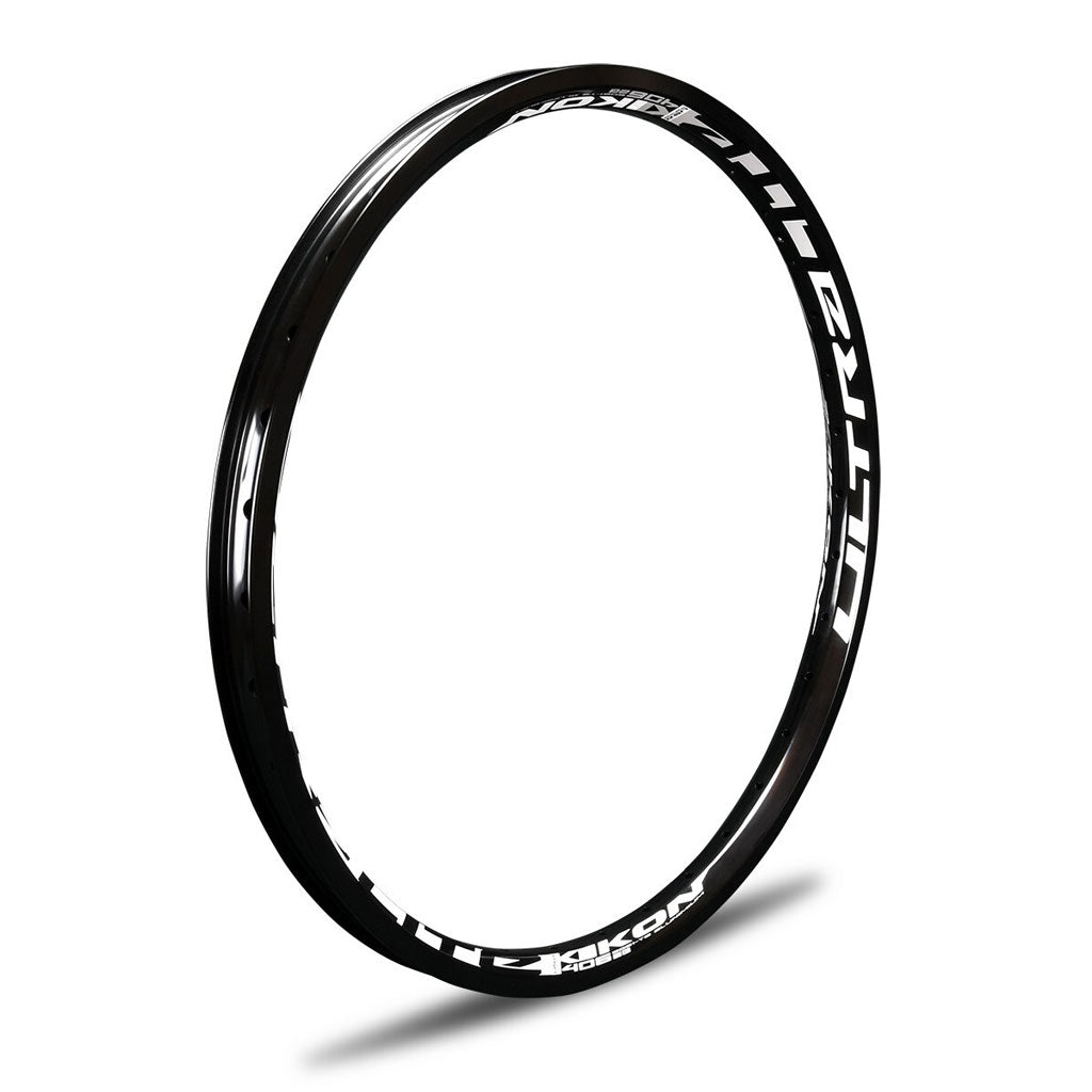 A black IKON ALLOY RIM (20 x 1.75 BRAKE) with white lettering on it.