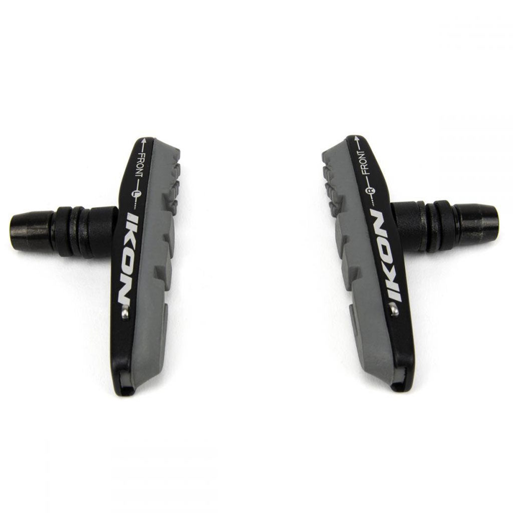 Two black and gray IKON Brake Pads to suit Carbon Rims, renowned for their excellent wet weather performance, are positioned against a white background.