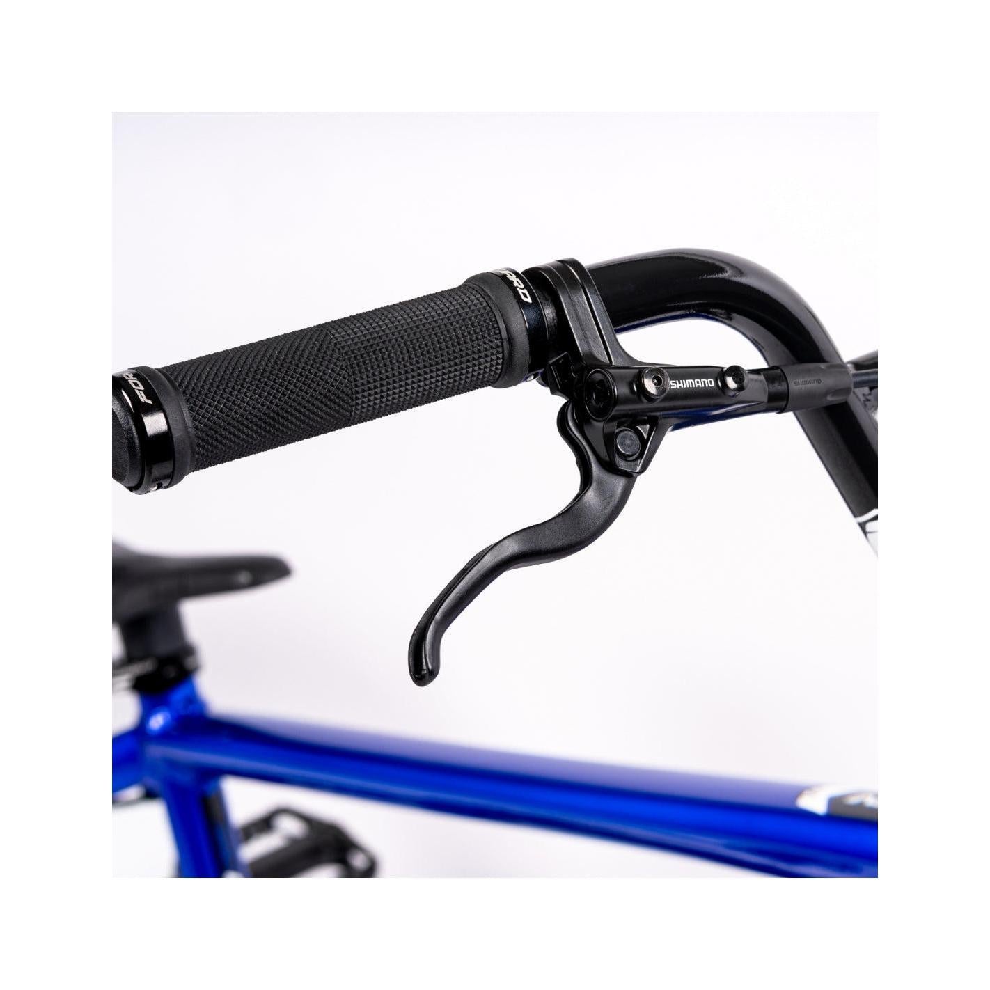 A close up of a blue handlebar on an Inspyre Evo Disc Pro XXL Bike.