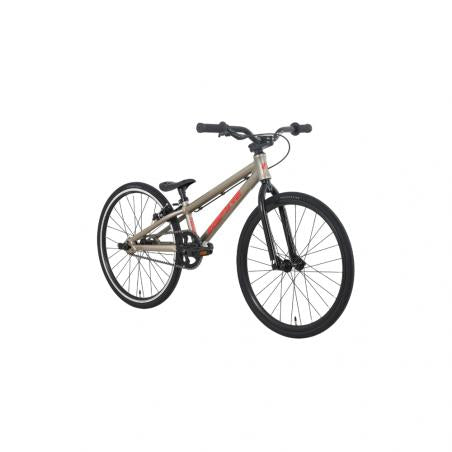 The Inspyre Neo Mini Race Bike (2027) is a tan BMX-style bicycle featuring black handlebars, a black saddle, and black wheels, shown against a plain white background. Designed as an ideal entry-level race bike, it provides the perfect setup for beginner riders eager to start BMX racing.
