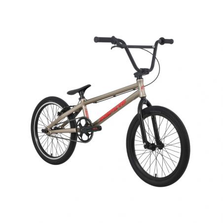 Matte gray Inspyre Neo Pro L Race Bike (2027) BMX with black handlebars, black tires, sealed hubs, a single gear, and red logo detailing, shown from a front-side angle.