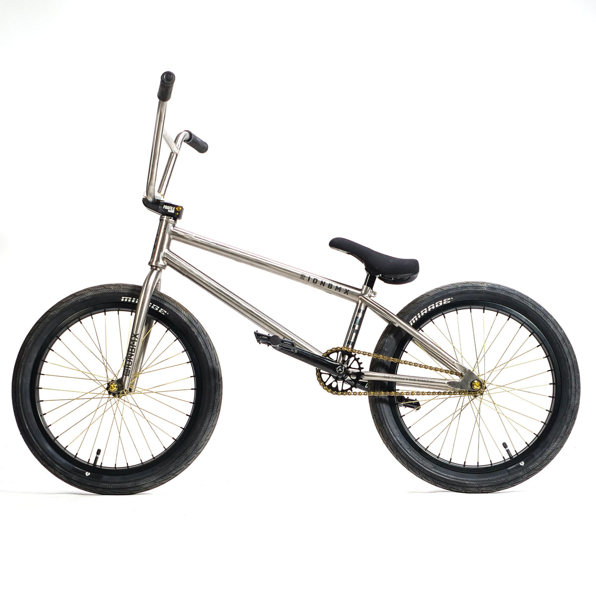 ION BMX TiXX 20 Inch Bike with a titanium frame, silver finish, black tires, and a gold chain against a white background.