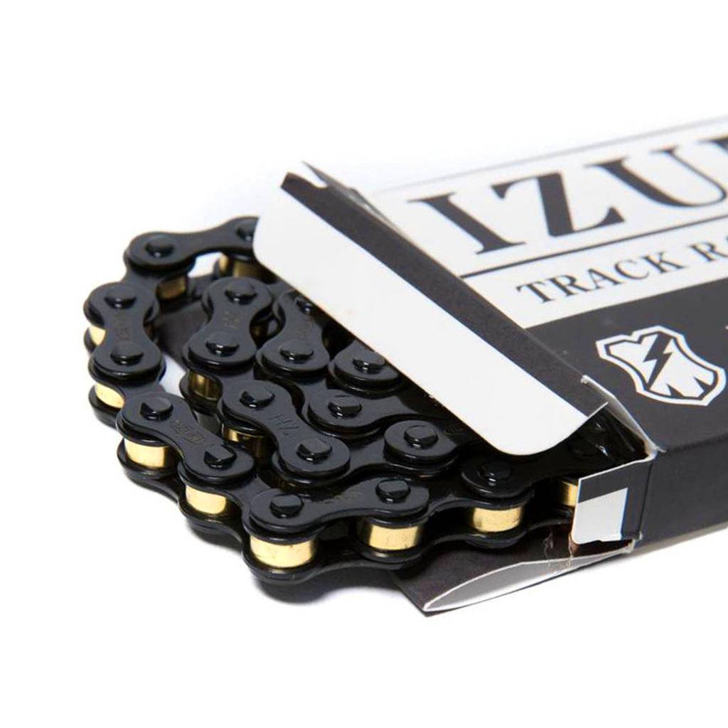 A partially opened box reveals a black and gold bicycle chain labeled "Izumi Mash Chain," known among track and keirin racers for its reliability.