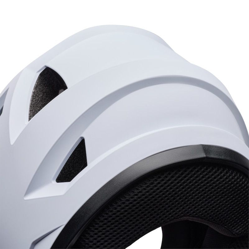 Close-up of the Bell Sanction 2 White helmet featuring a black mesh interior and angular vents, highlighting the detailed design and texture of this entry-level helmet.