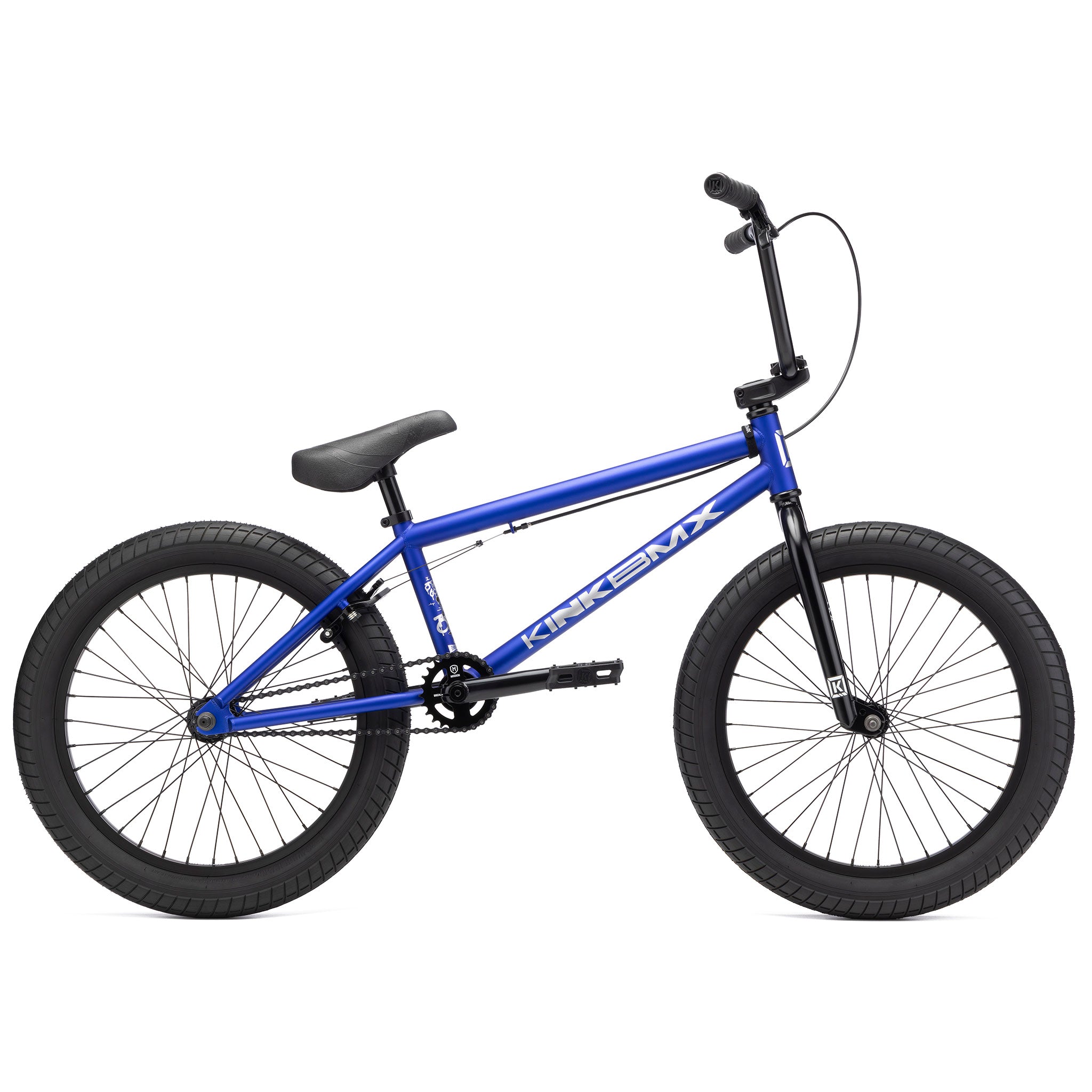 A Kink Curb 20 Inch Bike with thick Mission Tracker Tyres, a black seat, and the brand name "Kink BMX" displayed on the frame.