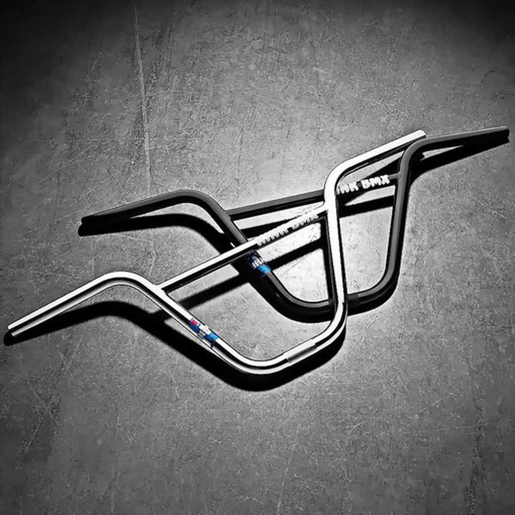 The Kink Williams Bars, crafted from rugged chromoly tubing using TruTherm heat treatment, intersect gracefully on a dark, textured surface.