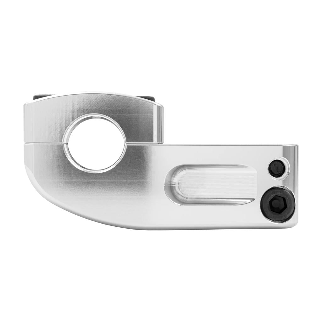 Close-up of a machined metal component with a circular hole, two black hex bolts, and a brushed silver finish, showcasing the top load stem design of the Odyssey Broc Raiford V2 Stem for BMX handlebars.