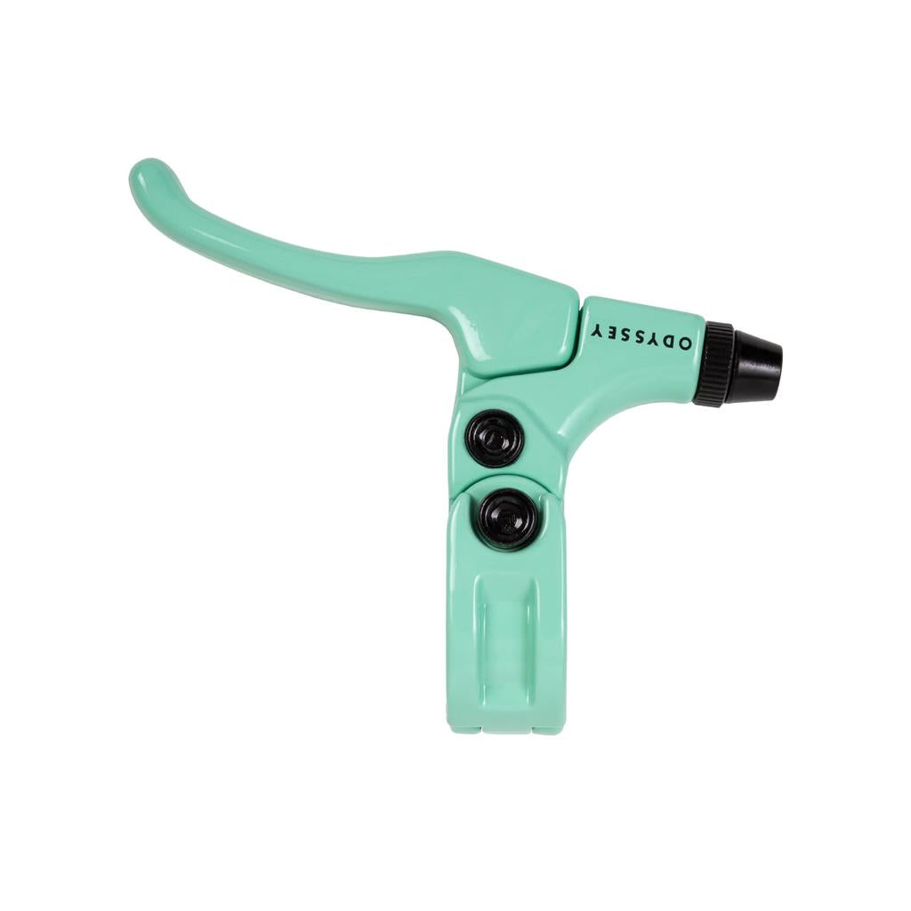 The Odyssey Monolever Medium Lever in mint green features a hinged clamp, black adjustment bolts, and Odyssey branding on the lever body—a trusted choice for pro riders.