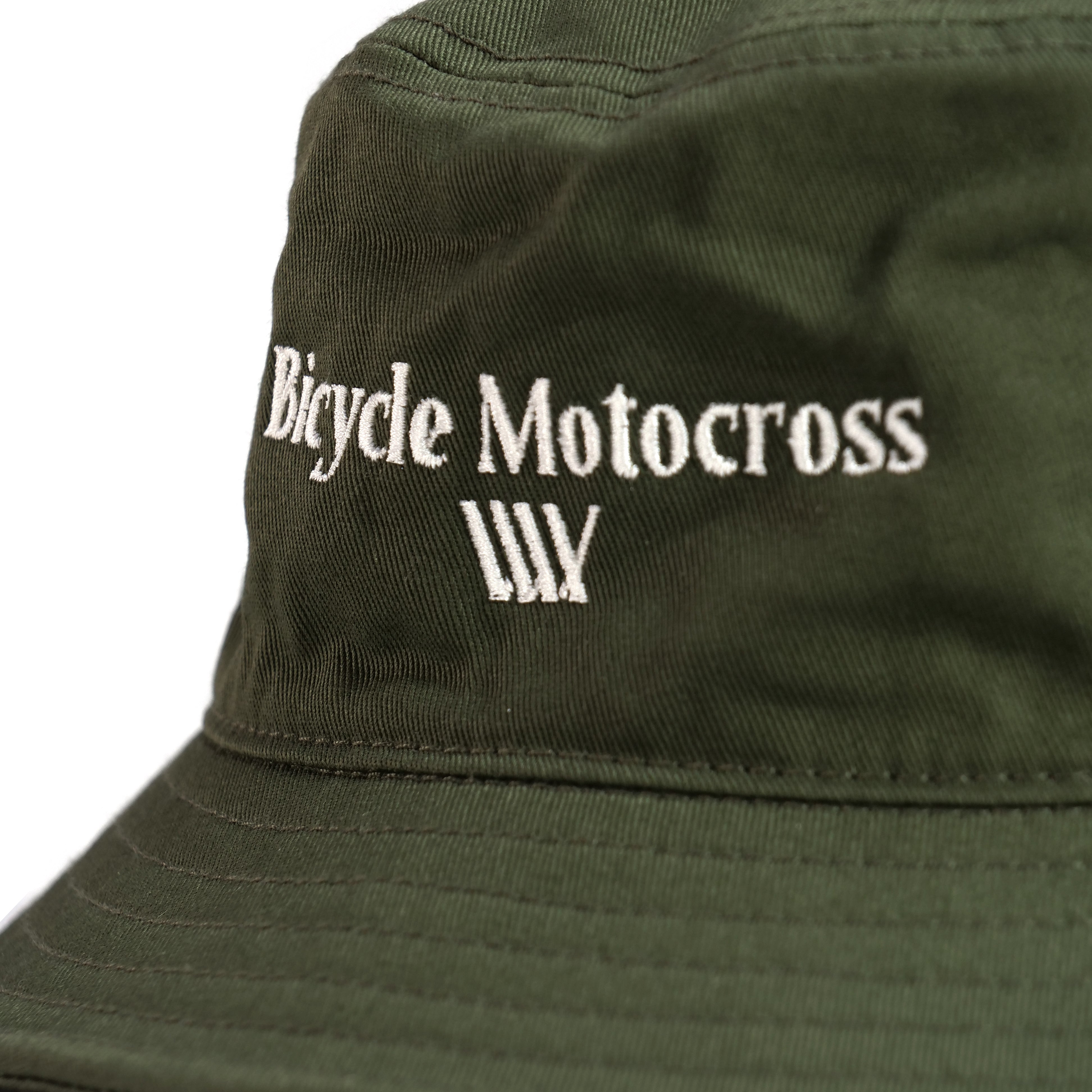 Close-up of the LUXBMX Bicycle Motocross Bucket Hat in olive, featuring "Bicycle Motocross" embroidered in white on the front.