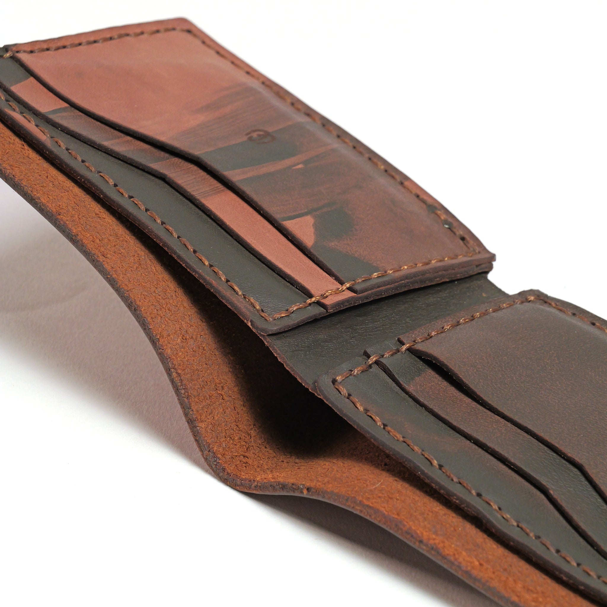 Close-up of the LUXBMX Bifold Leather Wallet, handmade in Queensland from full-grain leather with multiple card slots and visible stitching, photographed on a white background.